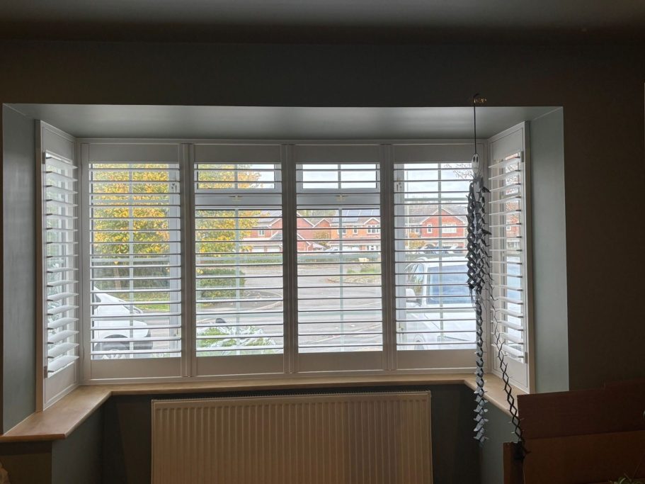 Custom plantation shutters on bay window in Apley Telford home | Elegant privacy & light control by ShireLuxe Shutters Shropshire