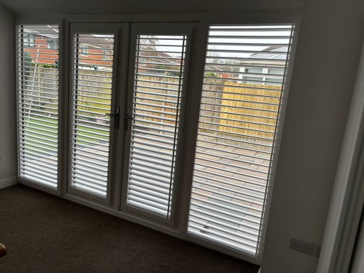 Waterproof perfect fit plantation shutters on Telford patio doors | Seamless outdoor privacy by ShireLuxe Shutters Shropshire