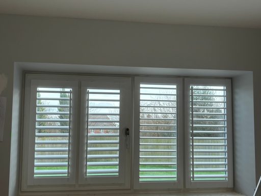 Frameless perfect fit shutters on tilt and turn window in Shropshire home | Seamless functionality & privacy by ShireLuxe Shutters Telford