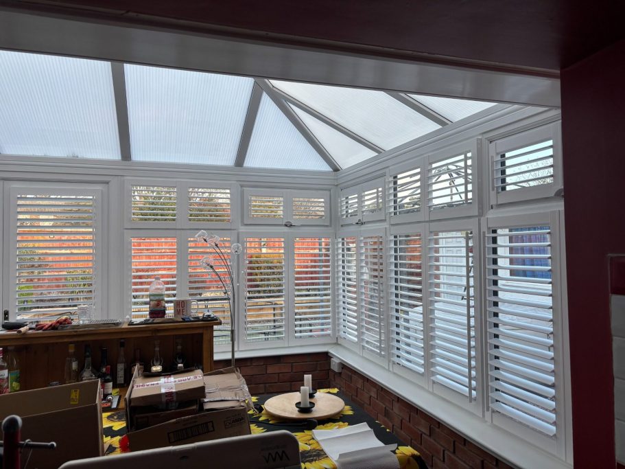 Frameless perfect fit plantation shutters in High Ercall conservatory | Seamless light control & privacy by ShireLuxe Shutters Shropshire