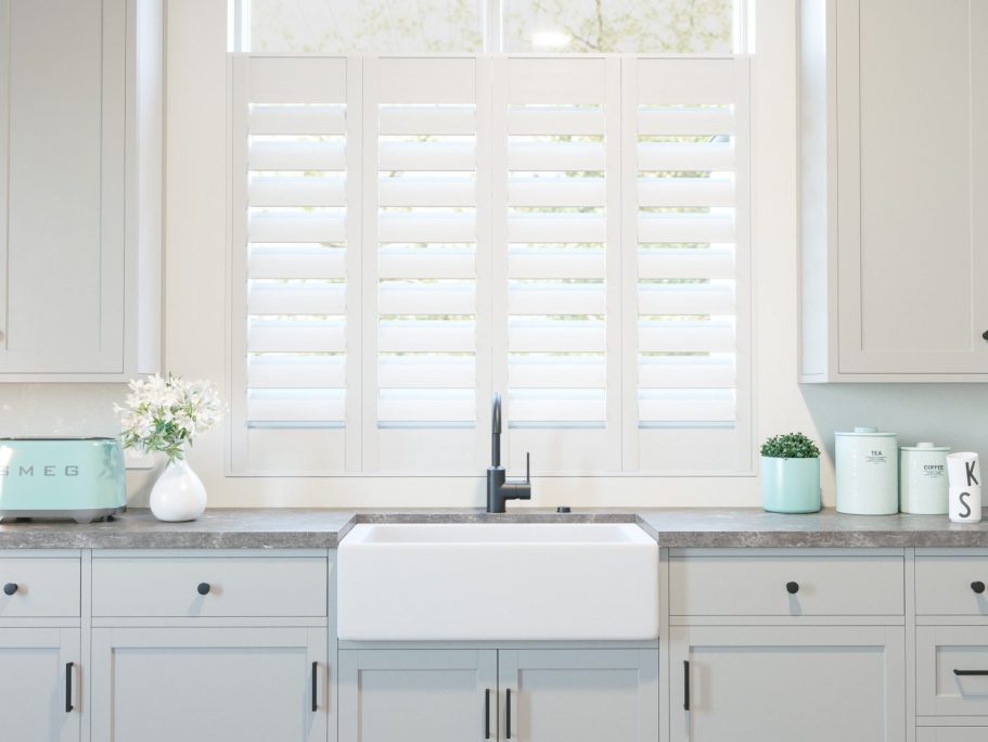 Cafe style plantation shutters in Shawbury kitchen window | Natural light & privacy solution by ShireLuxe Shutters Shropshire