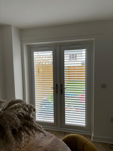 Perfect fit faux wood shutters on Wombourne patio | Durable outdoor privacy by ShireLuxe Shutters Shropshire